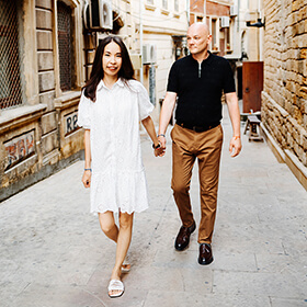 Couple walking through the streets of Baku Old Town, Azerbaijan
