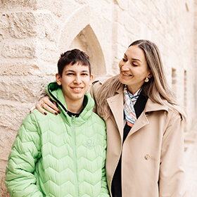 Mother and son walking together in Icherisheher Old City Baku